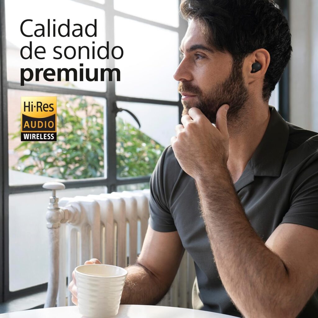 Hombre disfrutando de sonido premium con auriculares inalámbricos en la oficina